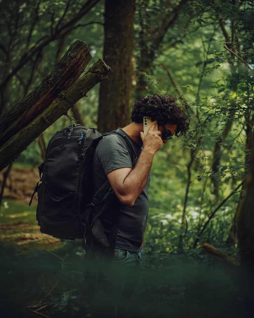 Man answering a phone call outdoors